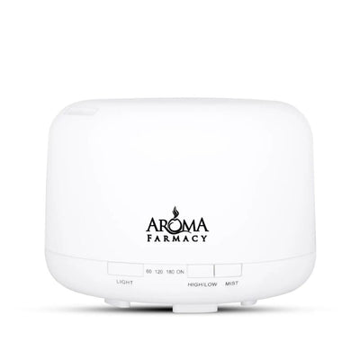A white Aroma Pharmacy branded diffuser with control buttons and aroma light. The logo is black and the text is white, displaying 'Aroma Pharmacy'